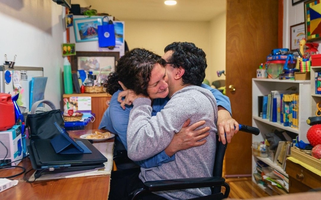 A caregiver and client sharing a warm, trusting moment
